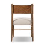 Mixed materials place a modern twist on the sling-back dining chair. A solid oak frame forms rounded dowel legs for a touch of traditionalism, with top-grain leather in a warm chestnut Amethyst Home provides interior design, new home construction design consulting, vintage area rugs, and lighting in the San Diego metro area.