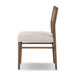 Mixed materials place a modern twist on the sling-back dining chair. A solid oak frame forms rounded dowel legs for a touch of traditionalism, with top-grain leather in a warm chestnut Amethyst Home provides interior design, new home construction design consulting, vintage area rugs, and lighting in the Tampa metro area.
