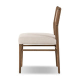 Mixed materials place a modern twist on the sling-back dining chair. A solid oak frame forms rounded dowel legs for a touch of traditionalism, with top-grain leather in a warm chestnut Amethyst Home provides interior design, new home construction design consulting, vintage area rugs, and lighting in the Tampa metro area.