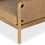 Safari inspiration meets zen aspirations. A cylindrical frame is crafted, smoothed and rounded from solid ash wood. Includes two loose feather-blend cushions covered in subtly distressed thick cut leather in a neutral taupe hue for a monochromatic look Amethyst Home provides interior design, new home construction design consulting, vintage area rugs, and lighting in the Calabasas metro area.