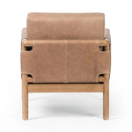 Safari inspiration meets zen aspirations. A cylindrical frame is crafted, smoothed and rounded from solid ash wood. Includes two loose feather-blend cushions covered in subtly distressed thick cut leather in a neutral taupe hue for a monochromatic look Amethyst Home provides interior design, new home construction design consulting, vintage area rugs, and lighting in the Dallas metro area.