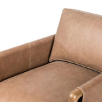 Safari inspiration meets zen aspirations. A cylindrical frame is crafted, smoothed and rounded from solid ash wood. Includes two loose feather-blend cushions covered in subtly distressed thick cut leather in a neutral taupe hue for a monochromatic look Amethyst Home provides interior design, new home construction design consulting, vintage area rugs, and lighting in the Houston metro area.