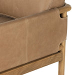 Safari inspiration meets zen aspirations. A cylindrical frame is crafted, smoothed and rounded from solid ash wood. Includes two loose feather-blend cushions covered in subtly distressed thick cut leather in a neutral taupe hue for a monochromatic look Amethyst Home provides interior design, new home construction design consulting, vintage area rugs, and lighting in the Laguna Beach metro area.