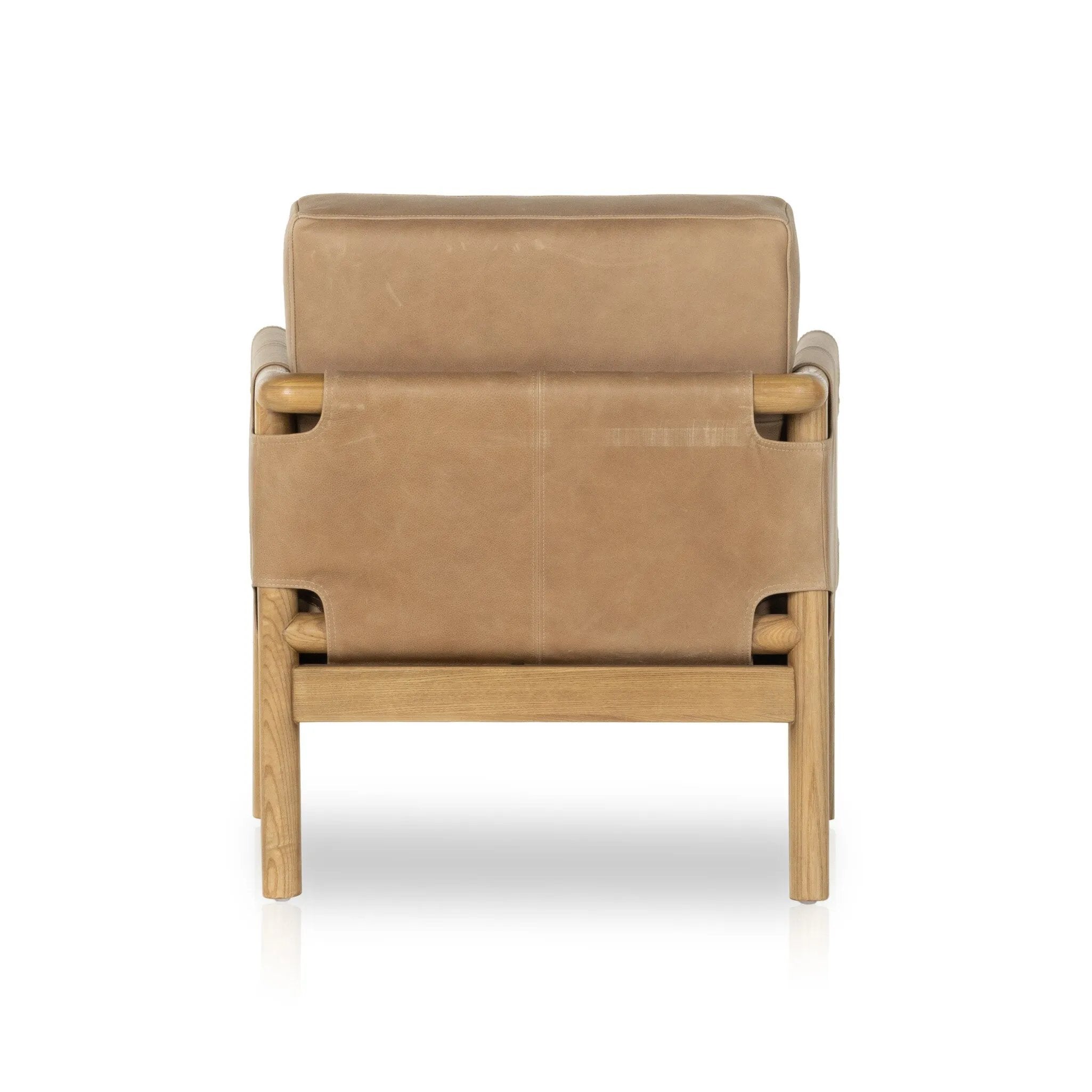 Safari inspiration meets zen aspirations. A cylindrical frame is crafted, smoothed and rounded from solid ash wood. Includes two loose feather-blend cushions covered in subtly distressed thick cut leather in a neutral taupe hue for a monochromatic look Amethyst Home provides interior design, new home construction design consulting, vintage area rugs, and lighting in the Winter Garden metro area.