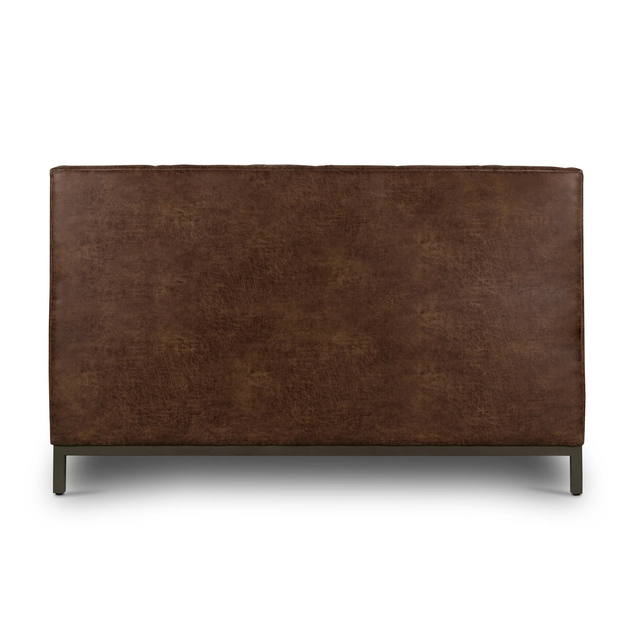 Subtle, modern elegance. A low, tufted headboard in a vintage tobacco faux leather pairs with a simple gunmetal iron base Amethyst Home provides interior design, new home construction design consulting, vintage area rugs, and lighting in the Alpharetta metro area.