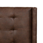 Subtle, modern elegance. A low, tufted headboard in a vintage tobacco faux leather pairs with a simple gunmetal iron base Amethyst Home provides interior design, new home construction design consulting, vintage area rugs, and lighting in the Des Moines metro area.