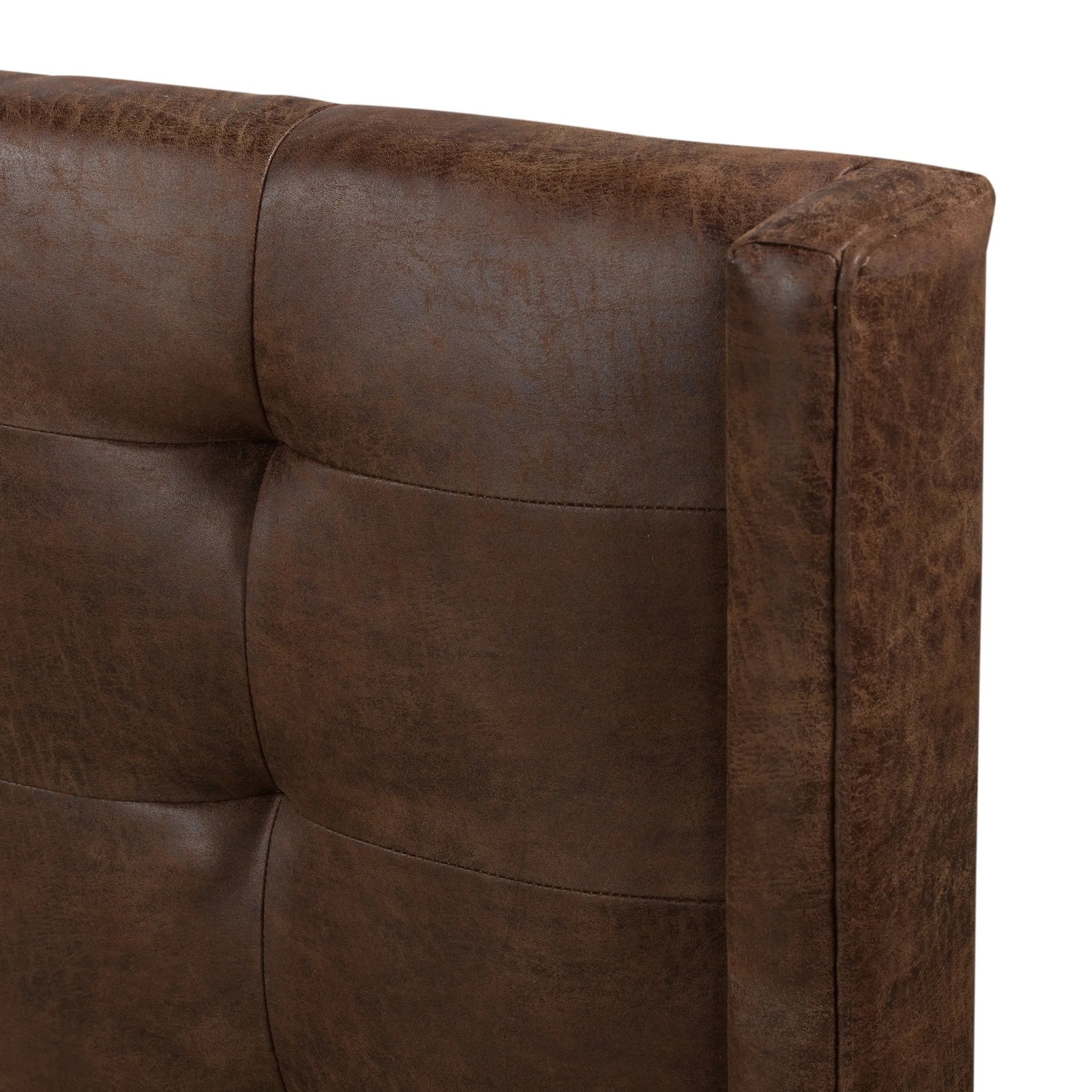 Subtle, modern elegance. A low, tufted headboard in a vintage tobacco faux leather pairs with a simple gunmetal iron base Amethyst Home provides interior design, new home construction design consulting, vintage area rugs, and lighting in the Los Angeles metro area.