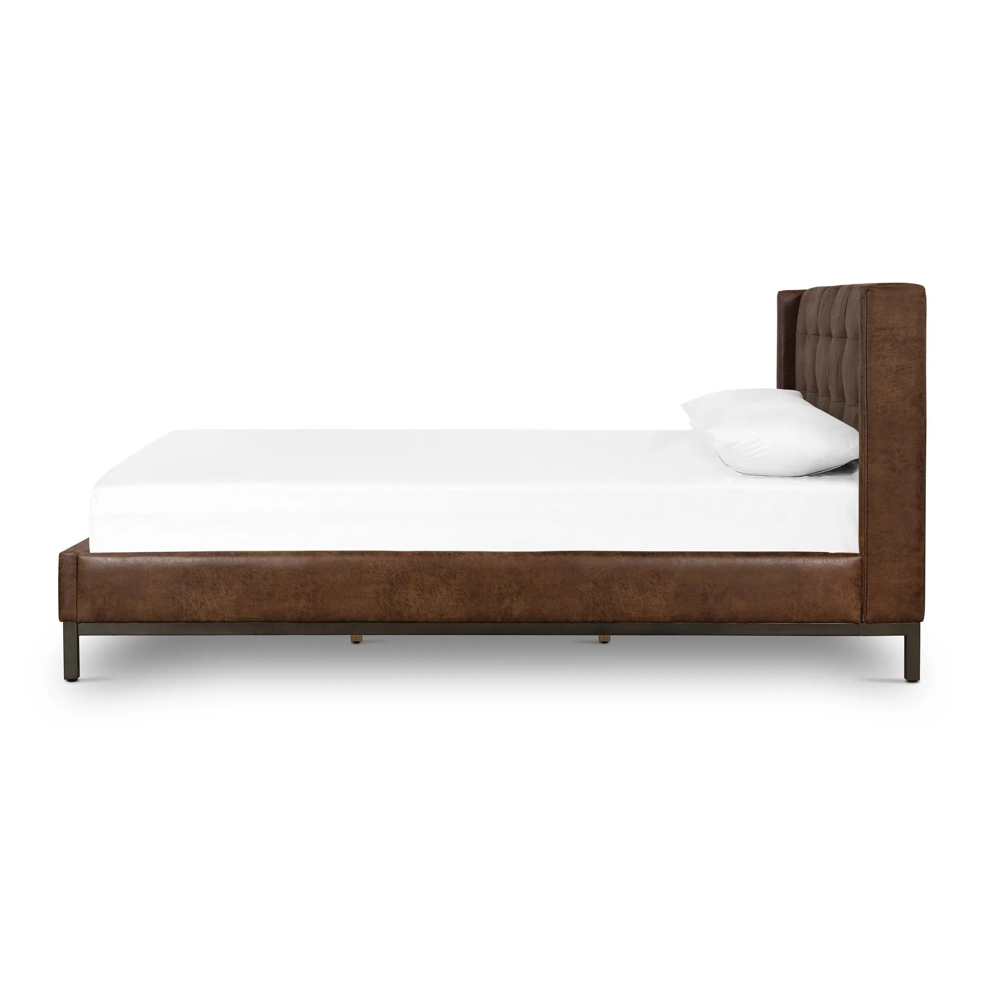 Subtle, modern elegance. A low, tufted headboard in a vintage tobacco faux leather pairs with a simple gunmetal iron base Amethyst Home provides interior design, new home construction design consulting, vintage area rugs, and lighting in the Monterey metro area.