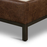 Subtle, modern elegance. A low, tufted headboard in a vintage tobacco faux leather pairs with a simple gunmetal iron base Amethyst Home provides interior design, new home construction design consulting, vintage area rugs, and lighting in the Seattle metro area.