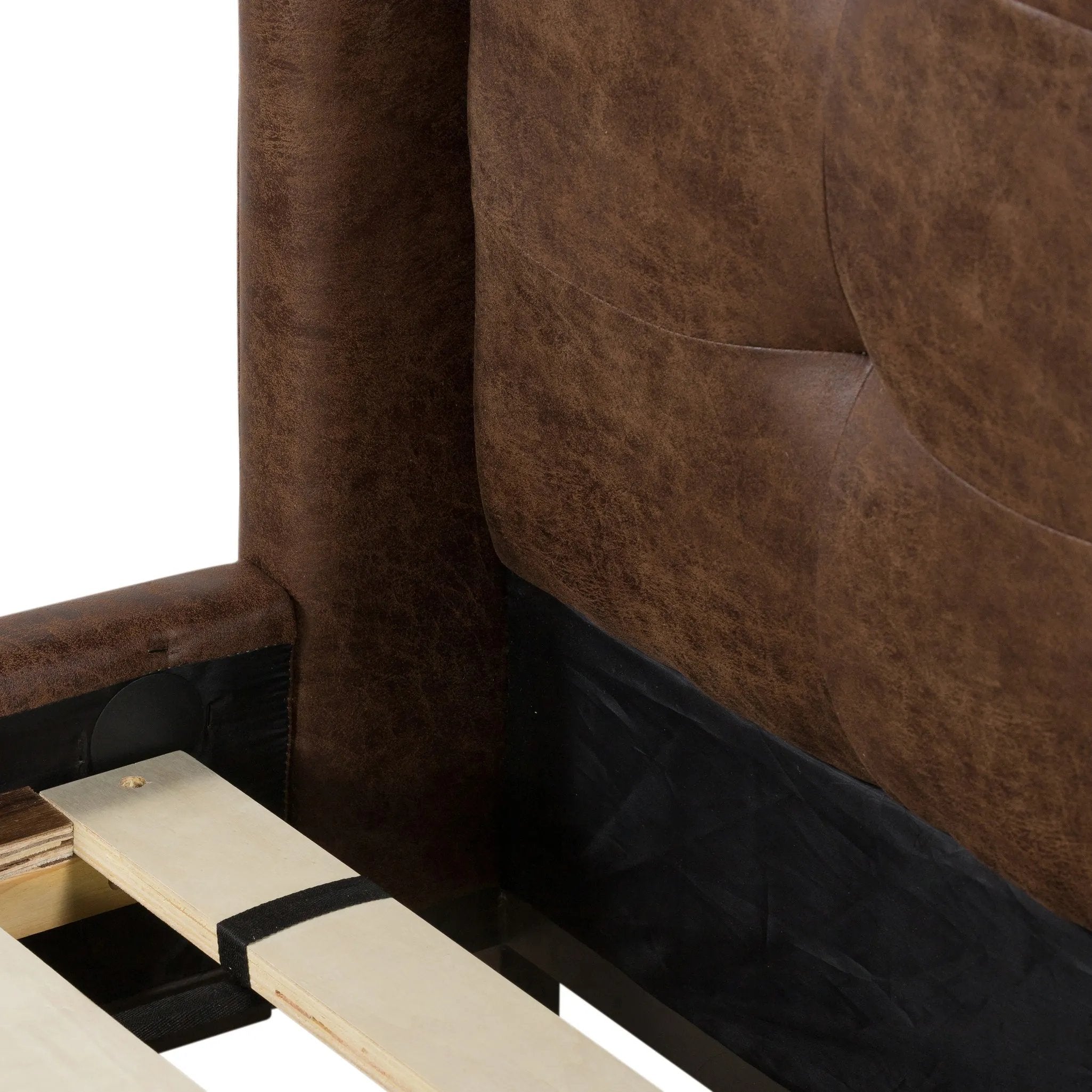 Subtle, modern elegance. A low, tufted headboard in a vintage tobacco faux leather pairs with a simple gunmetal iron base Amethyst Home provides interior design, new home construction design consulting, vintage area rugs, and lighting in the Washington metro area.