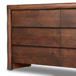 Made from solid acacia and finished in a rustic brown, a six-drawer, waterfall-shaped dresser features soft volume, mitered corners and a faux live edge Amethyst Home provides interior design, new home construction design consulting, vintage area rugs, and lighting in the Portland metro area.