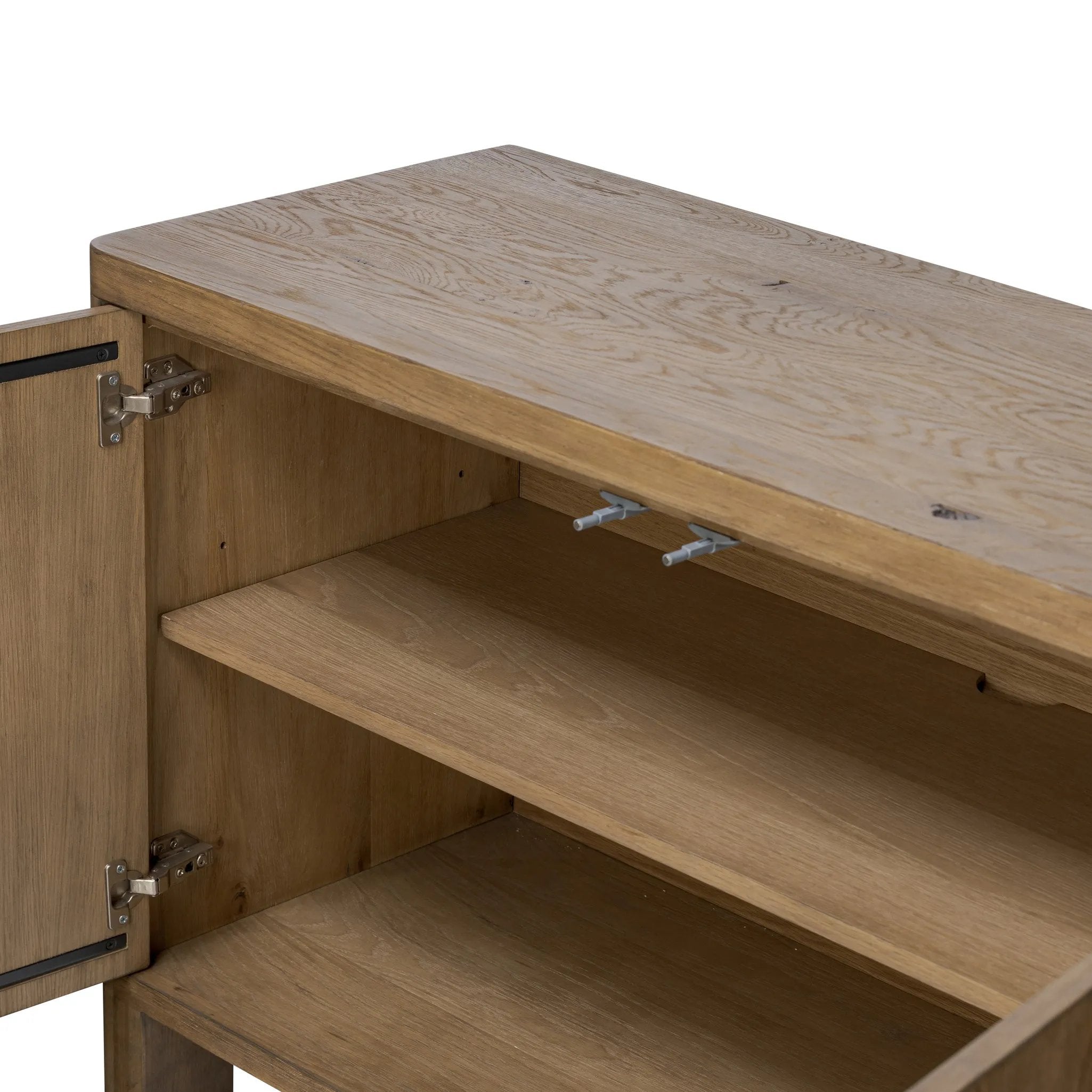 Made from resawn oak with a worn, natural finish, a long, streamlined sideboard offers ample storage space behind four push-latch doors. Subtly rounded corners add softness to otherwise clean lines, while knots and graining offer a naturally rich look. Dual rear cutouts for seamless cord management Amethyst Home provides interior design, new home construction design consulting, vintage area rugs, and lighting in the Kansas City metro area.