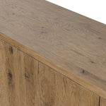 Made from resawn oak with a worn, natural finish, a long, streamlined sideboard offers ample storage space behind four push-latch doors. Subtly rounded corners add softness to otherwise clean lines, while knots and graining offer a naturally rich look. Dual rear cutouts for seamless cord management Amethyst Home provides interior design, new home construction design consulting, vintage area rugs, and lighting in the Portland metro area.