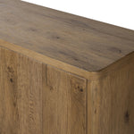 Made from resawn oak with a worn, natural finish, a long, streamlined sideboard offers ample storage space behind four push-latch doors. Subtly rounded corners add softness to otherwise clean lines, while knots and graining offer a naturally rich look. Dual rear cutouts for seamless cord management Amethyst Home provides interior design, new home construction design consulting, vintage area rugs, and lighting in the Salt Lake City metro area.