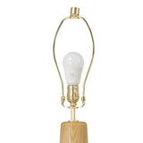 Modern minimal meets traditional. A tapered wood floor lamp base is topped with a design-forward boucle linen shade Amethyst Home provides interior design, new home construction design consulting, vintage area rugs, and lighting in the Seattle metro area.