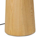 Modern minimal meets traditional. A tapered wood floor lamp base is topped with a design-forward boucle linen shade Amethyst Home provides interior design, new home construction design consulting, vintage area rugs, and lighting in the Tampa metro area.