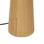 Modern minimal meets traditional. A tapered wood table lamp base is topped with a design-forward boucle linen shade Amethyst Home provides interior design, new home construction design consulting, vintage area rugs, and lighting in the Charlotte metro area.