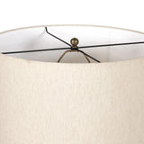 A striking silhouette. An antique brass finish highlights iron's gradual blending of hues for a distinctive ombre effect on this tapered metal base. Topped with a 100% cotton shade Amethyst Home provides interior design, new home construction design consulting, vintage area rugs, and lighting in the Houston metro area.