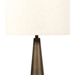 A striking silhouette. An antique brass finish highlights iron's gradual blending of hues for a distinctive ombre effect on this tapered metal base. Topped with a 100% cotton shade Amethyst Home provides interior design, new home construction design consulting, vintage area rugs, and lighting in the Newport Beach metro area.