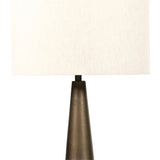 A striking silhouette. An antique brass finish highlights iron's gradual blending of hues for a distinctive ombre effect on this tapered metal base. Topped with a 100% cotton shade Amethyst Home provides interior design, new home construction design consulting, vintage area rugs, and lighting in the Newport Beach metro area.