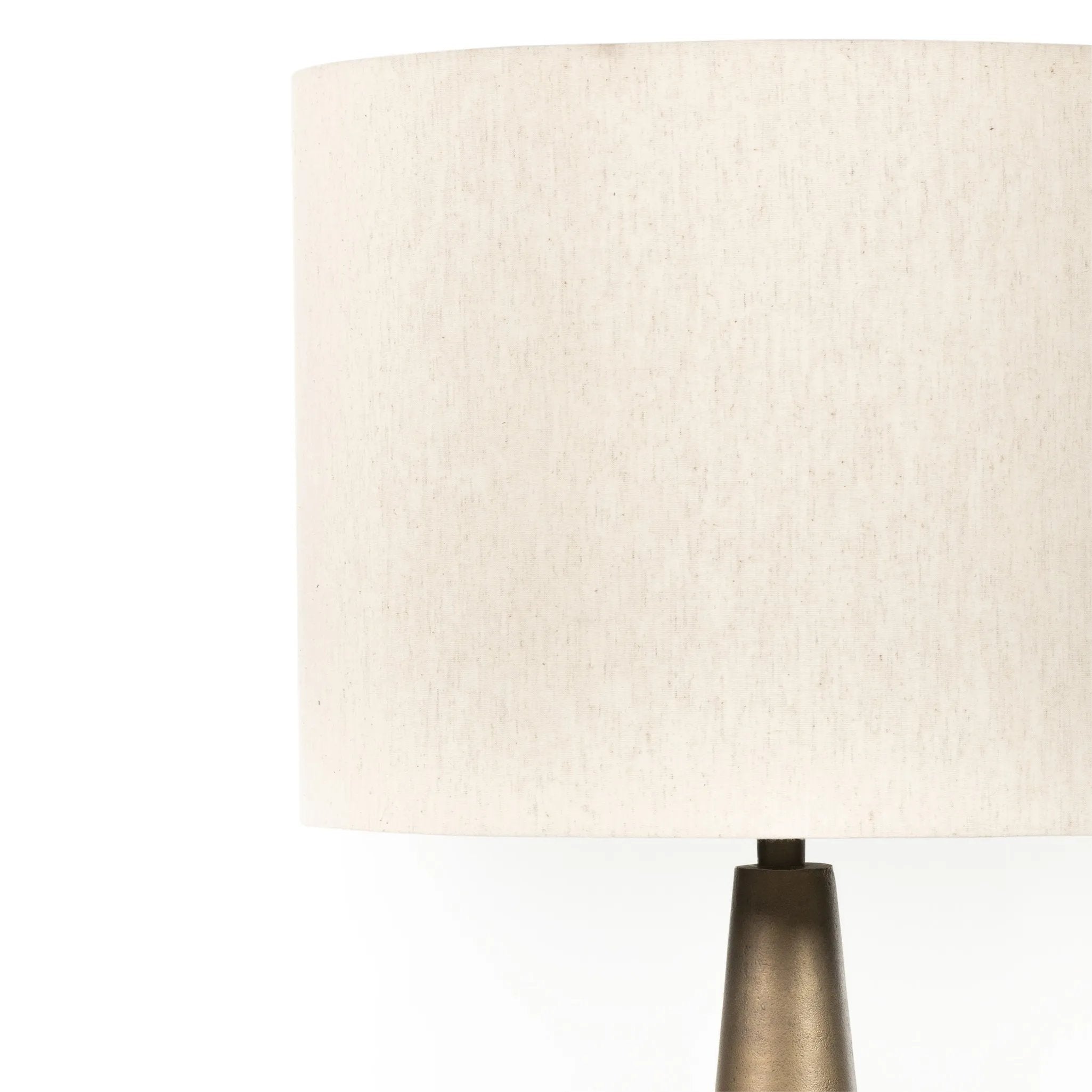 A striking silhouette. An antique brass finish highlights iron's gradual blending of hues for a distinctive ombre effect on this tapered metal base. Topped with a 100% cotton shade Amethyst Home provides interior design, new home construction design consulting, vintage area rugs, and lighting in the Tampa metro area.