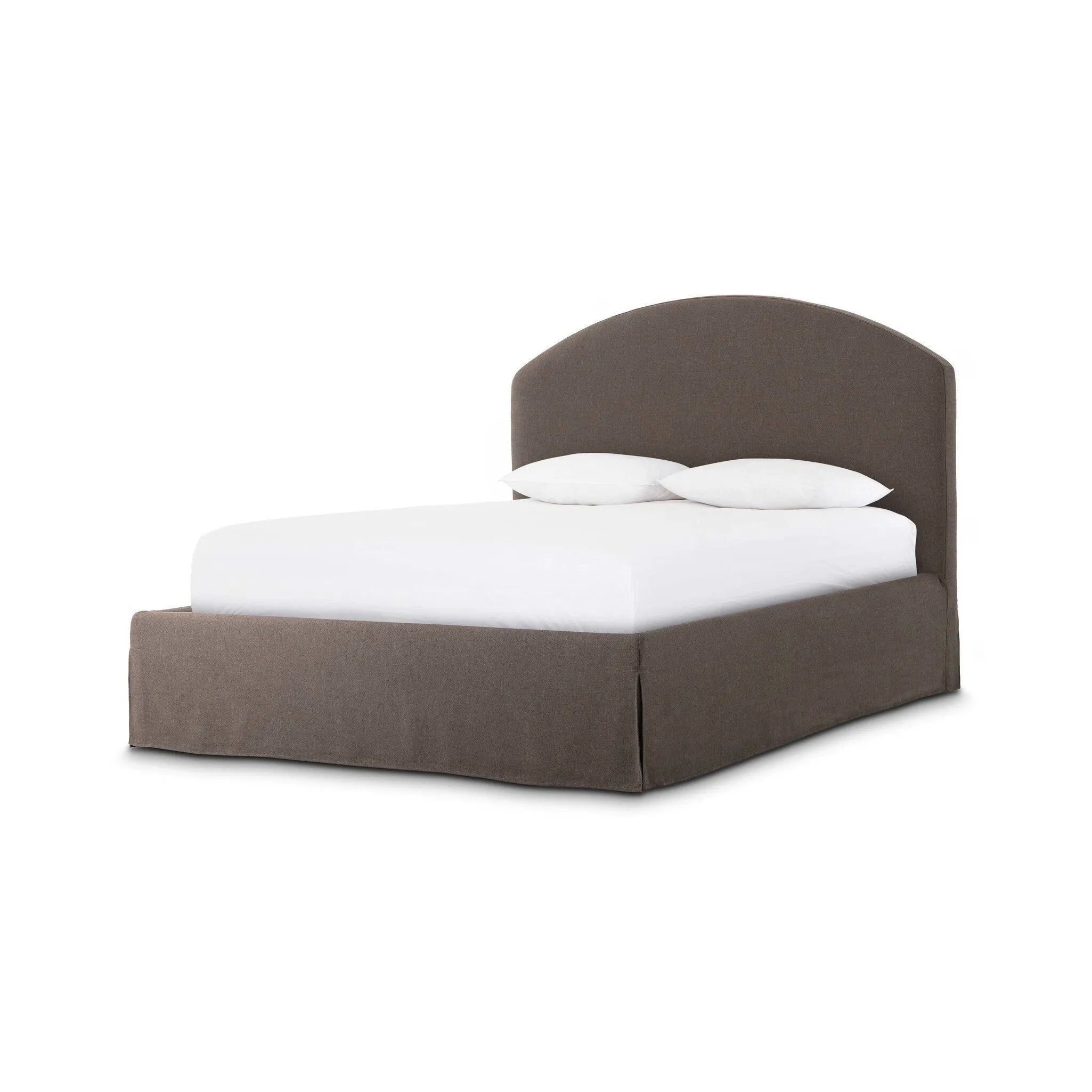 An arched headboard and simple frame act as the perfect canvas for your favorite bedding. A soft textural linen slipcover in a rich brown hue contributes a cozy yet refined look Amethyst Home provides interior design, new home construction design consulting, vintage area rugs, and lighting in the Winter Garden metro area.