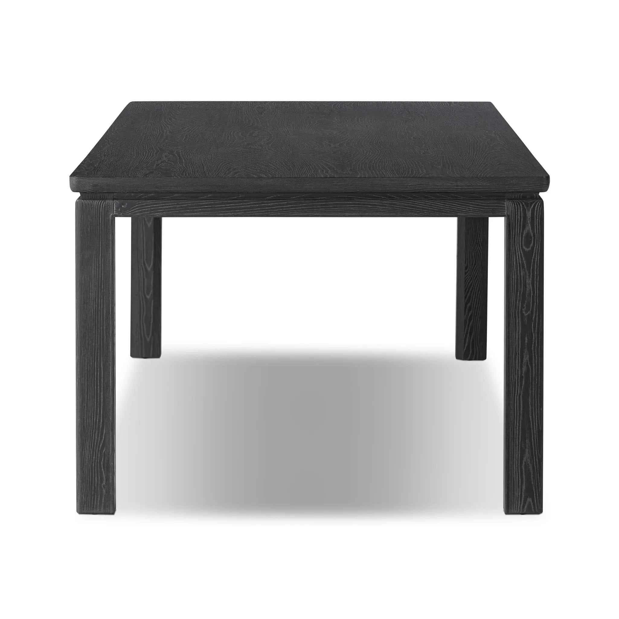 The timeless Parsons table is reimagined, with a rustic black finish and unique relief detail between the tabletop and apron Amethyst Home provides interior design, new home construction design consulting, vintage area rugs, and lighting in the Des Moines metro area.