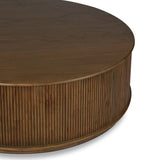 An artisanal take on texture. Made from amber-finished mindi with a plinth-style base, a reeding pattern is carved around the entirety of this coffee table table for a fresh, approachable look.As lovers of natural aesthetics at Amethyst, we love the warm modern inspired Ona Coffee Table - Amber Mindi Veneer. Amethyst Home provides interior design, new home construction design consulting, vintage area rugs, and lighting in the Tampa metro area.