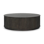 An artisanal take on texture. Made from black-finished mindi with a plinth-style base, a reeding pattern is carved around the entirety of this coffee table table for a fresh, approachable look.As fans of clean style at Amethyst, we love the nature inspired Ona Coffee Table - Smoked Black Mindi - Smoked Black Mindi Veneer. Amethyst Home provides interior design, new home construction design consulting, vintage area rugs, and lighting in the Houston metro area.