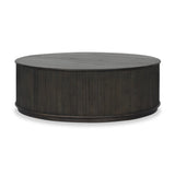 An artisanal take on texture. Made from black-finished mindi with a plinth-style base, a reeding pattern is carved around the entirety of this coffee table table for a fresh, approachable look.As fans of clean style at Amethyst, we love the nature inspired Ona Coffee Table - Smoked Black Mindi - Smoked Black Mindi Veneer. Amethyst Home provides interior design, new home construction design consulting, vintage area rugs, and lighting in the Kansas City metro area.