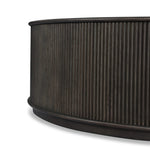 An artisanal take on texture. Made from black-finished mindi with a plinth-style base, a reeding pattern is carved around the entirety of this coffee table table for a fresh, approachable look.As fans of clean style at Amethyst, we love the nature inspired Ona Coffee Table - Smoked Black Mindi - Smoked Black Mindi Veneer. Amethyst Home provides interior design, new home construction design consulting, vintage area rugs, and lighting in the Omaha metro area.
