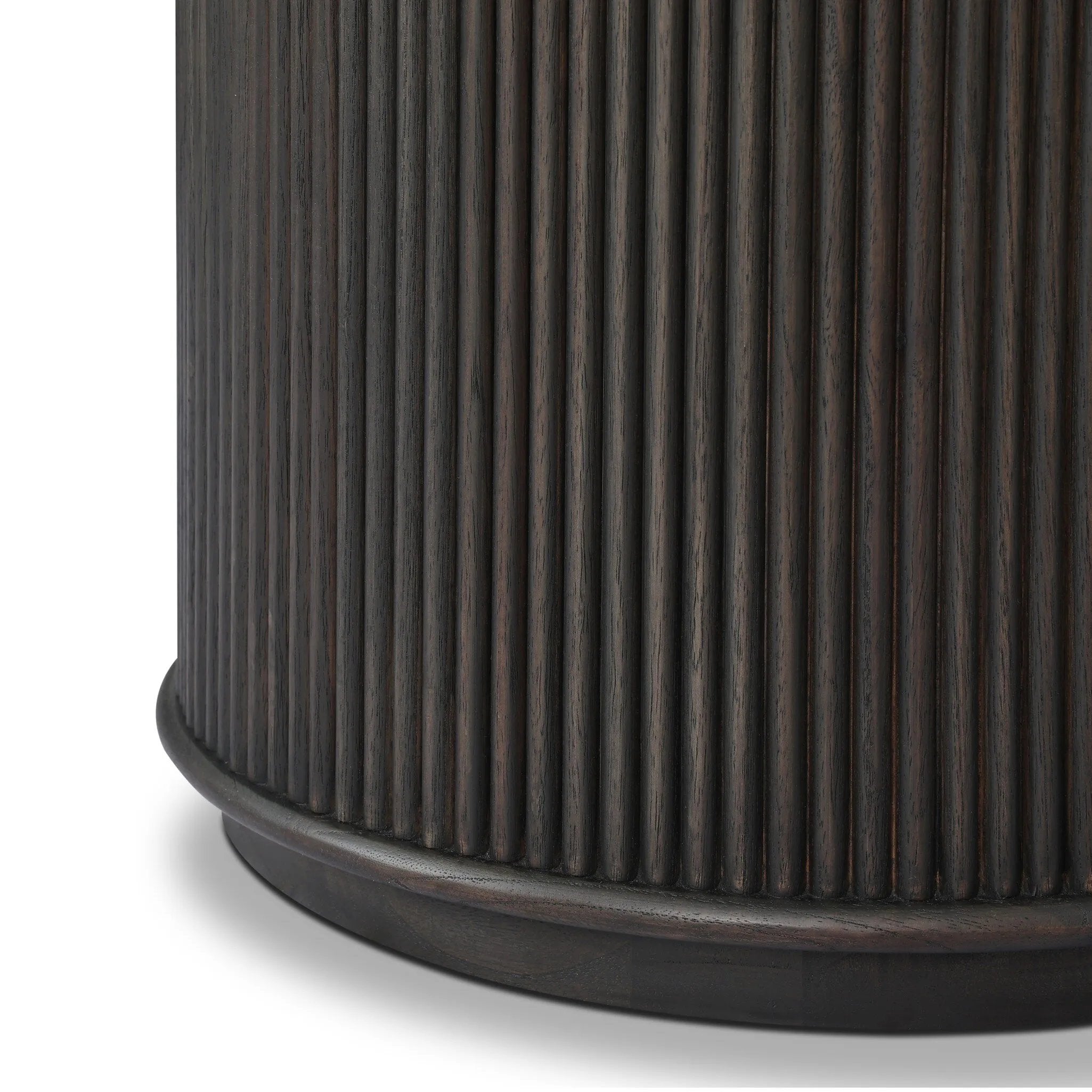 An artisanal take on texture. Made from black-finished mindi wood with a plinth-style base, a reeding pattern is carved around the entirety of this versatile end table for a fresh, approachable look.As lovers of luxe aesthetics at Amethyst, we love the optimistic inspired Ona End Table - Smoked Black Mindi Veneer. Amethyst Home provides interior design, new home construction design consulting, vintage area rugs, and lighting in the Los Angeles metro area.
