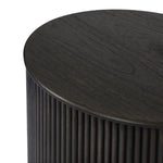 An artisanal take on texture. Made from black-finished mindi wood with a plinth-style base, a reeding pattern is carved around the entirety of this versatile end table for a fresh, approachable look.As lovers of luxe aesthetics at Amethyst, we love the optimistic inspired Ona End Table - Smoked Black Mindi Veneer. Amethyst Home provides interior design, new home construction design consulting, vintage area rugs, and lighting in the Newport Beach metro area.