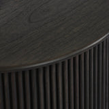 An artisanal take on texture. Made from black-finished mindi wood with a plinth-style base, a reeding pattern is carved around the entirety of this versatile end table for a fresh, approachable look.As lovers of luxe aesthetics at Amethyst, we love the optimistic inspired Ona End Table - Smoked Black Mindi Veneer. Amethyst Home provides interior design, new home construction design consulting, vintage area rugs, and lighting in the Park City metro area.