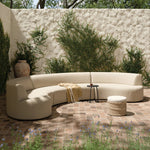 Bring a hint of old-Hollywood glamour outdoors with this soft, sculptural sectional. Plush cushioning all around is upholstered in UV-resistant, water-repellent, quick-drying fabric. Cover or store inside during inclement weather and when not in use. Amethyst Home provides interior design, new home construction design consulting, vintage area rugs, and lighting in the Alpharetta metro area.
