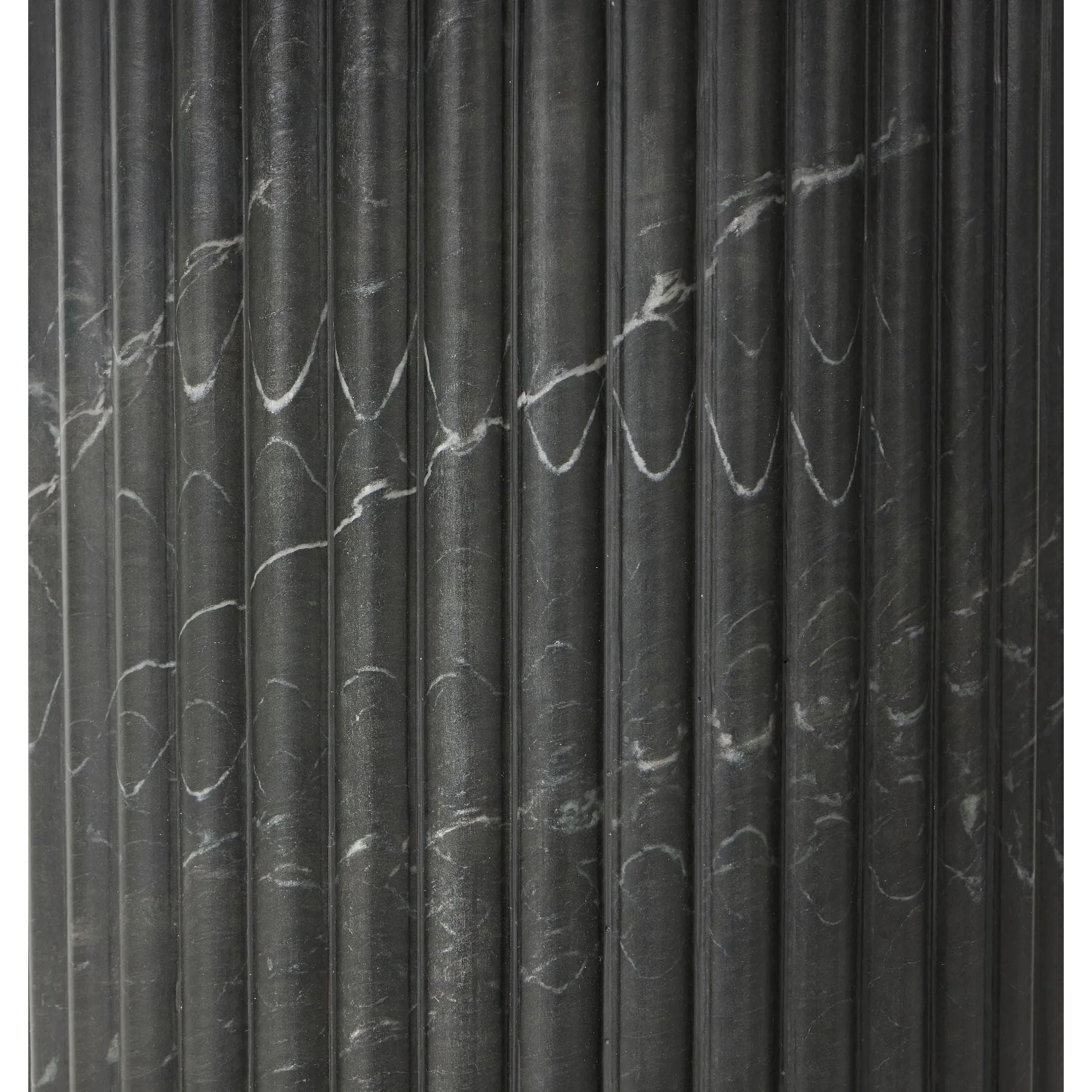 Inspired by Italian design, a swirling marble base is scalloped for a linear look with heavy texture, finished with a rounded, bistro-size tabletop of polished black marble Amethyst Home provides interior design, new home construction design consulting, vintage area rugs, and lighting in the Calabasas metro area.