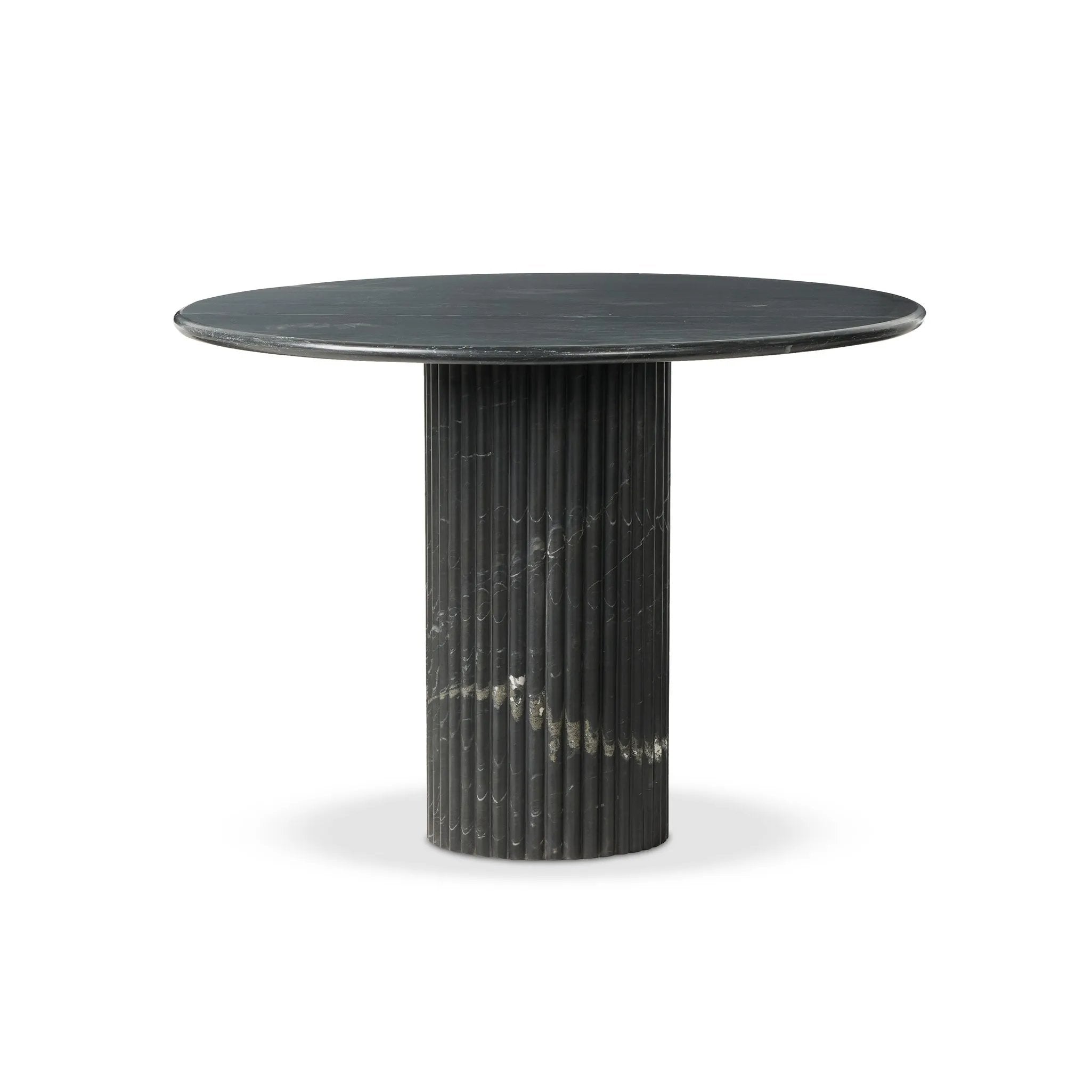 Inspired by Italian design, a swirling marble base is scalloped for a linear look with heavy texture, finished with a rounded, bistro-size tabletop of polished black marble Amethyst Home provides interior design, new home construction design consulting, vintage area rugs, and lighting in the Charlotte metro area.