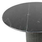 Inspired by Italian design, a swirling marble base is scalloped for a linear look with heavy texture, finished with a rounded, bistro-size tabletop of polished black marble Amethyst Home provides interior design, new home construction design consulting, vintage area rugs, and lighting in the Monterey metro area.
