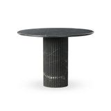 Inspired by Italian design, a swirling marble base is scalloped for a linear look with heavy texture, finished with a rounded, bistro-size tabletop of polished black marble Amethyst Home provides interior design, new home construction design consulting, vintage area rugs, and lighting in the Scottsdale metro area.
