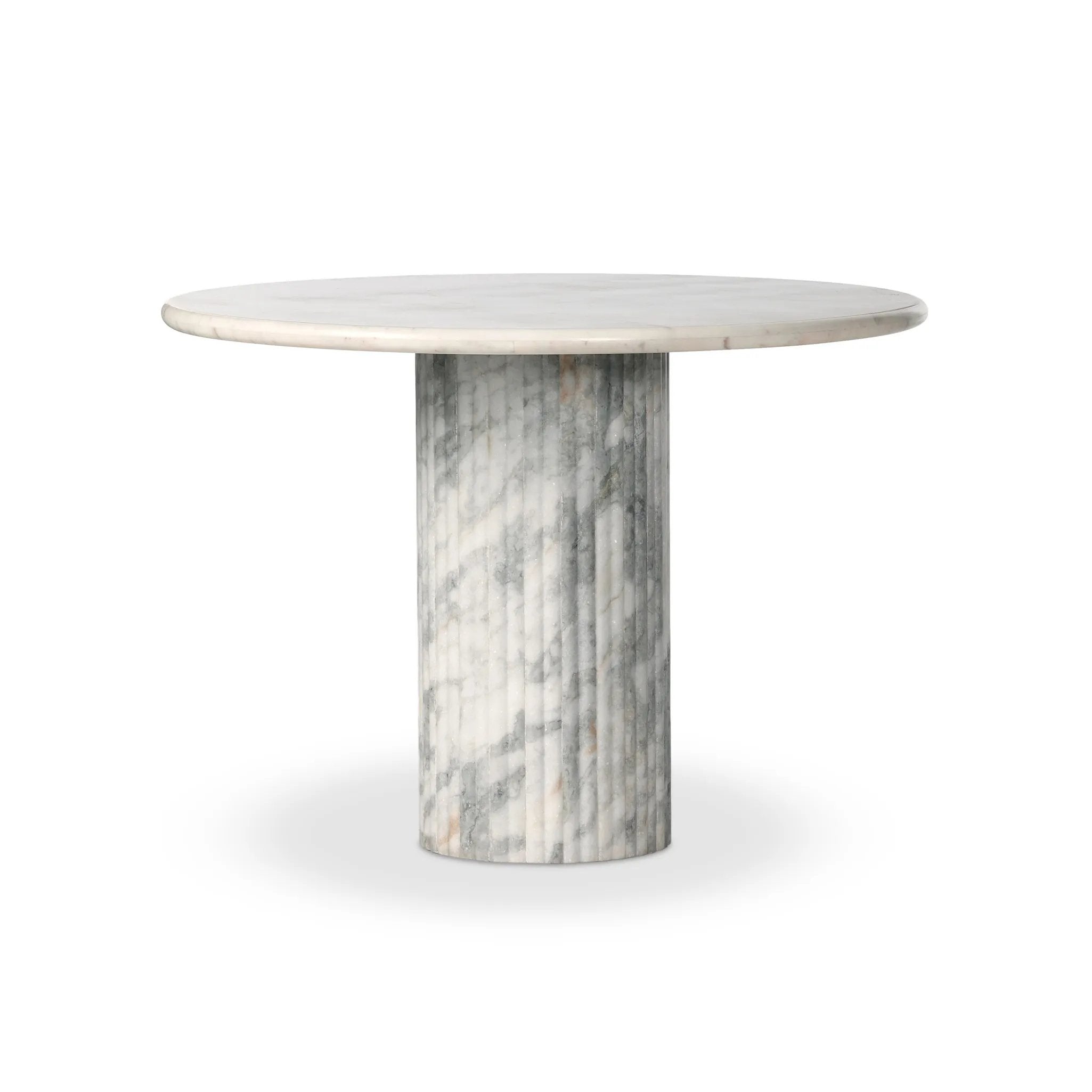 Featuring Oranda Polished White Marble Sealant Round Dining Table by Four Hands at Amethyst Home. Inspired by Italian design, a swirling marble base is scalloped for a linear look with heavy texture, finished with a rounded, bistro-size tabletop of polished white marble.Overall Dimensions: 42.00"w x 42.00"d x 30.00"hWeight : 195.00 lbsMaterials : Solid . Amethyst Home provides interior design, new home construction design consulting, vintage area rugs, and lighting in the Newport Beach metro area.