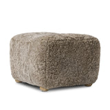 A subtle sweetheart shape paired with beige shearling plays into this ottoman's found object appeal. S-spring suspension offers a comfy place to sit and the shearling upholstery brings depth and vintage vibes throughout. Perfect styled alone or as part of a set for added drama. A design collaboration by Amber Lewis and Four Hands. Amethyst Home provides interior design, new home construction design consulting, vintage area rugs, and lighting in the Des Moines metro area.