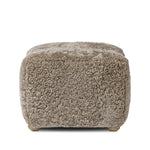 A subtle sweetheart shape paired with beige shearling plays into this ottoman's found object appeal. S-spring suspension offers a comfy place to sit and the shearling upholstery brings depth and vintage vibes throughout. Perfect styled alone or as part of a set for added drama. A design collaboration by Amber Lewis and Four Hands. Amethyst Home provides interior design, new home construction design consulting, vintage area rugs, and lighting in the Los Angeles metro area.