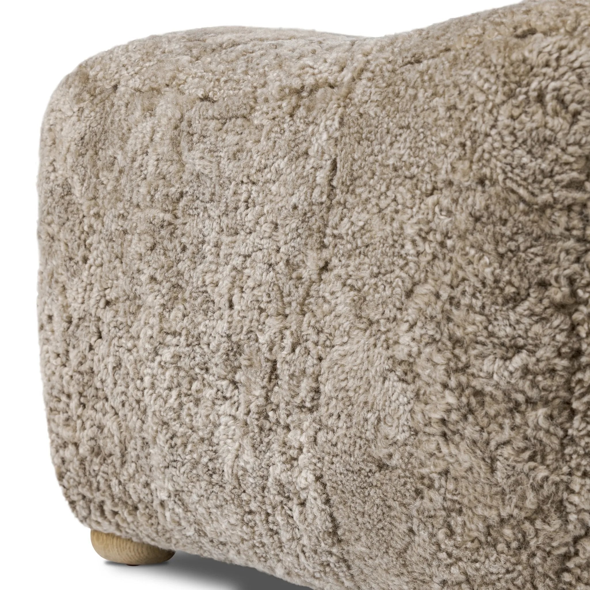 A subtle sweetheart shape paired with beige shearling plays into this ottoman's found object appeal. S-spring suspension offers a comfy place to sit and the shearling upholstery brings depth and vintage vibes throughout. Perfect styled alone or as part of a set for added drama. A design collaboration by Amber Lewis and Four Hands. Amethyst Home provides interior design, new home construction design consulting, vintage area rugs, and lighting in the Miami metro area.