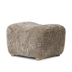 A subtle sweetheart shape paired with beige shearling plays into this ottoman's found object appeal. S-spring suspension offers a comfy place to sit and the shearling upholstery brings depth and vintage vibes throughout. Perfect styled alone or as part of a set for added drama. A design collaboration by Amber Lewis and Four Hands. Amethyst Home provides interior design, new home construction design consulting, vintage area rugs, and lighting in the Newport Beach metro area.