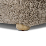 A subtle sweetheart shape paired with beige shearling plays into this ottoman's found object appeal. S-spring suspension offers a comfy place to sit and the shearling upholstery brings depth and vintage vibes throughout. Perfect styled alone or as part of a set for added drama. A design collaboration by Amber Lewis and Four Hands. Amethyst Home provides interior design, new home construction design consulting, vintage area rugs, and lighting in the Salt Lake City metro area.