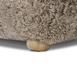 A subtle sweetheart shape paired with beige shearling plays into this ottoman's found object appeal. S-spring suspension offers a comfy place to sit and the shearling upholstery brings depth and vintage vibes throughout. Perfect styled alone or as part of a set for added drama. A design collaboration by Amber Lewis and Four Hands. Amethyst Home provides interior design, new home construction design consulting, vintage area rugs, and lighting in the Salt Lake City metro area.