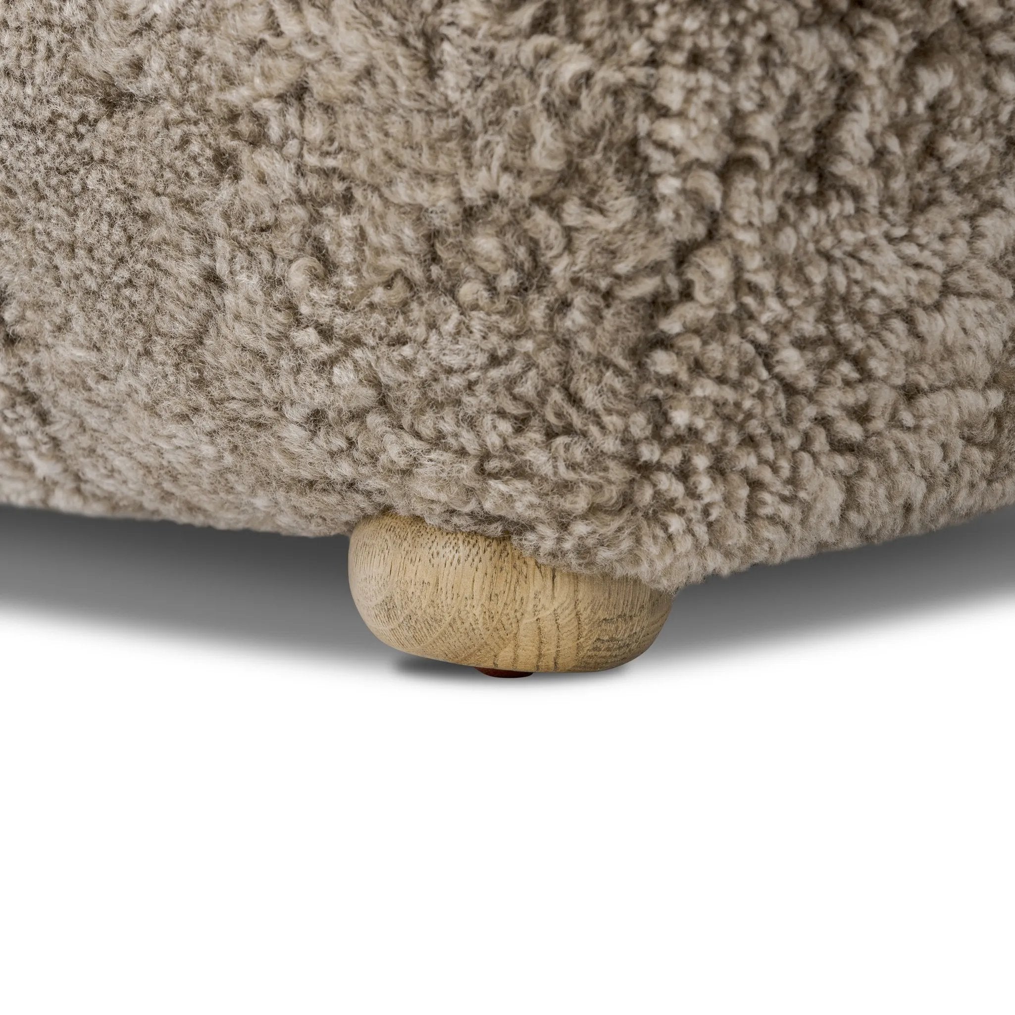 A subtle sweetheart shape paired with beige shearling plays into this ottoman's found object appeal. S-spring suspension offers a comfy place to sit and the shearling upholstery brings depth and vintage vibes throughout. Perfect styled alone or as part of a set for added drama. A design collaboration by Amber Lewis and Four Hands. Amethyst Home provides interior design, new home construction design consulting, vintage area rugs, and lighting in the Salt Lake City metro area.