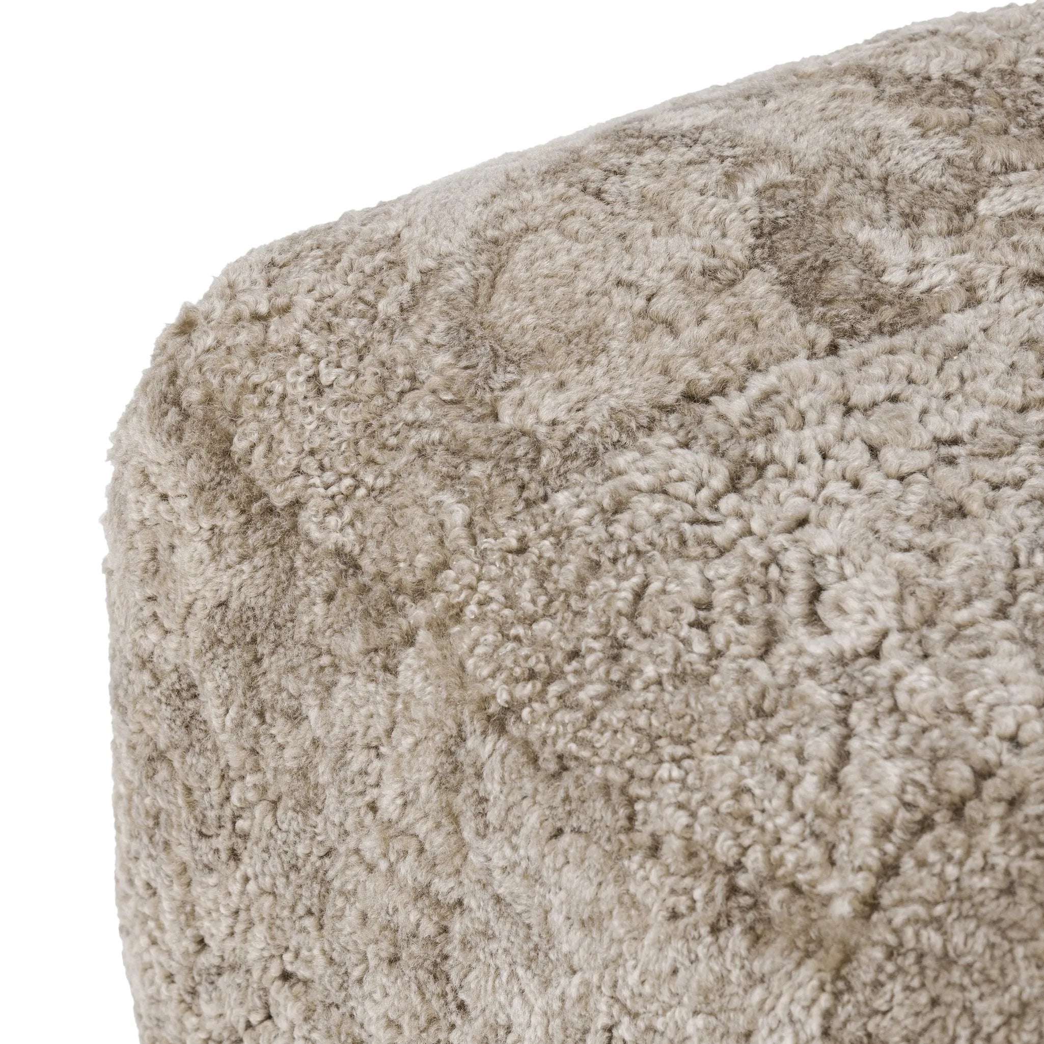 A subtle sweetheart shape paired with beige shearling plays into this ottoman's found object appeal. S-spring suspension offers a comfy place to sit and the shearling upholstery brings depth and vintage vibes throughout. Perfect styled alone or as part of a set for added drama. A design collaboration by Amber Lewis and Four Hands. Amethyst Home provides interior design, new home construction design consulting, vintage area rugs, and lighting in the San Diego metro area.