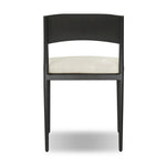 Streamlined and classic, this outdoor dining chair's simple silhouette features a subtly curved back on its matte black frame, finished with a cream linen-like seat cushion. Cover or store inside during inclement weather and when not in use. Amethyst Home provides interior design, new home construction design consulting, vintage area rugs, and lighting in the Des Moines metro area.