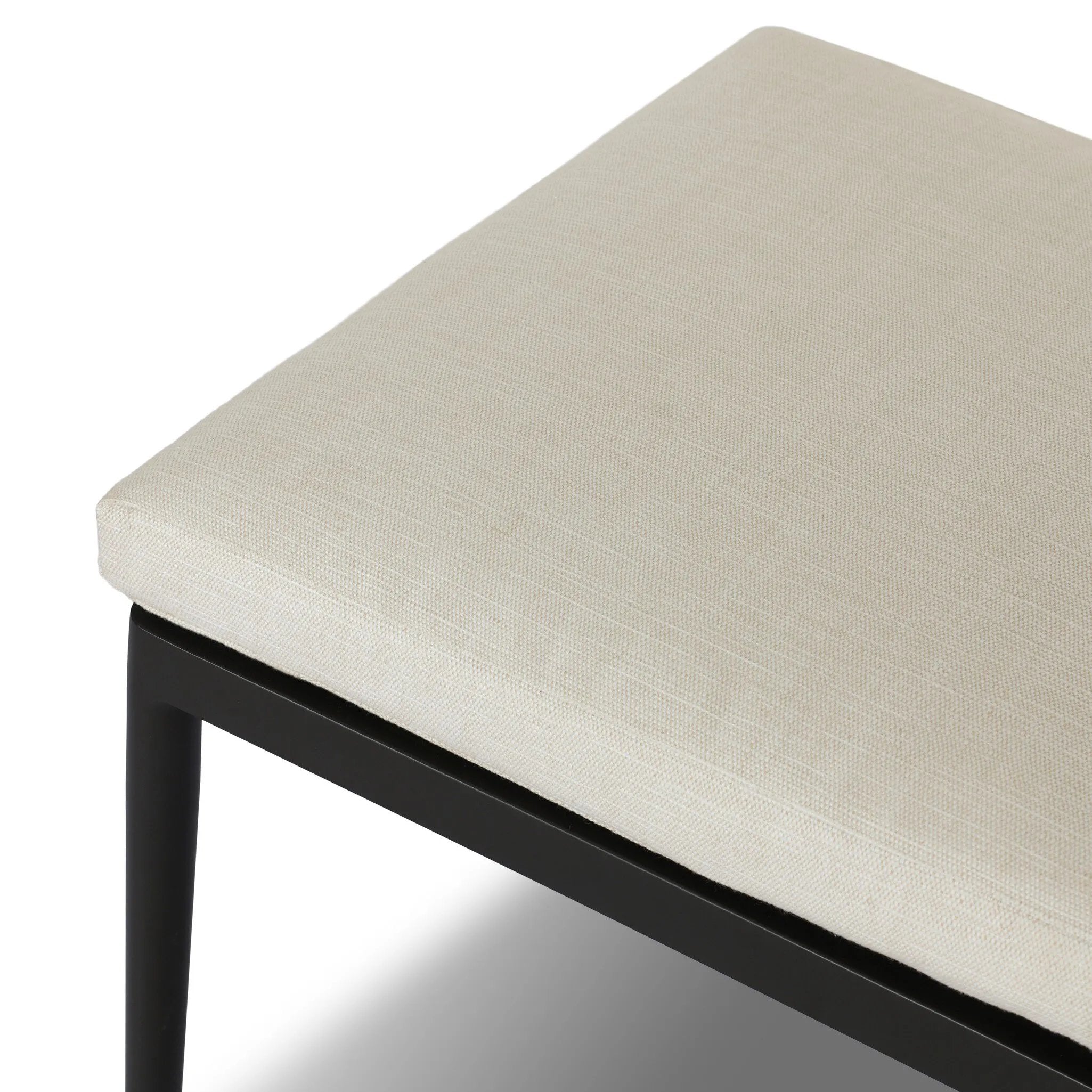 Streamlined and classic, this outdoor dining chair's simple silhouette features a subtly curved back on its matte black frame, finished with a cream linen-like seat cushion. Cover or store inside during inclement weather and when not in use. Amethyst Home provides interior design, new home construction design consulting, vintage area rugs, and lighting in the Houston metro area.